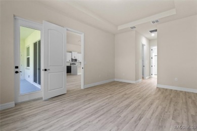 This home offers modern elegance and the tranquility of golf on Southern Woods Golf Club in Florida - for sale on GolfHomes.com, golf home, golf lot