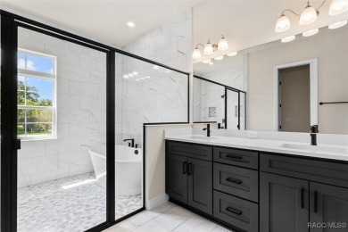 This home offers modern elegance and the tranquility of golf on Southern Woods Golf Club in Florida - for sale on GolfHomes.com, golf home, golf lot