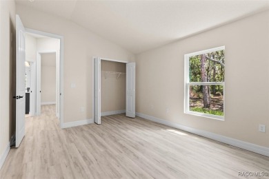 This home offers modern elegance and the tranquility of golf on Southern Woods Golf Club in Florida - for sale on GolfHomes.com, golf home, golf lot