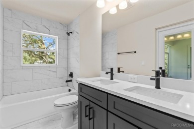 This home offers modern elegance and the tranquility of golf on Southern Woods Golf Club in Florida - for sale on GolfHomes.com, golf home, golf lot