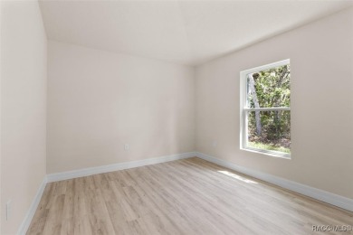 This home offers modern elegance and the tranquility of golf on Southern Woods Golf Club in Florida - for sale on GolfHomes.com, golf home, golf lot