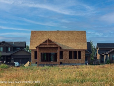 Welcome to 319 Bald Eagle Drive! This new construction home is a on Teton Reserve in Idaho - for sale on GolfHomes.com, golf home, golf lot