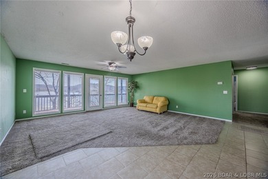 This isn't your typical lake condo-step inside and you'll feel on Lake Valley Country Club in Missouri - for sale on GolfHomes.com, golf home, golf lot