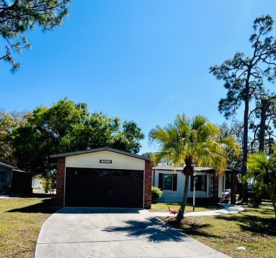 Welcome to this beautifully maintained 2-bedroom, 2-bath home in on Pine Lakes Country Club in Florida - for sale on GolfHomes.com, golf home, golf lot