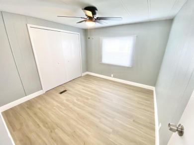 Remodeled Double-Wide manufactured home located in one of the on Barefoot Bay Golf Course in Florida - for sale on GolfHomes.com, golf home, golf lot