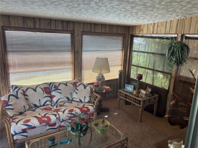 Spacious 2-bedroom, 2-bath home on a large corner lot with over on Zellwood Station Country Club in Florida - for sale on GolfHomes.com, golf home, golf lot