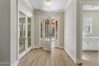 Welcome to your ideal coastal retreat! This beautiful 1.5 story on Crow Creek Golf Club in North Carolina - for sale on GolfHomes.com, golf home, golf lot