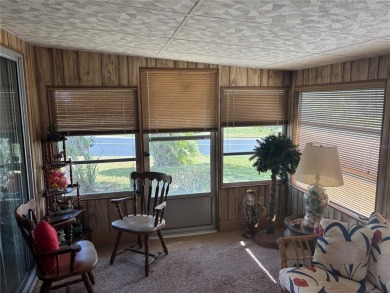 Spacious 2-bedroom, 2-bath home on a large corner lot with over on Zellwood Station Country Club in Florida - for sale on GolfHomes.com, golf home, golf lot