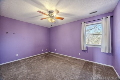 This isn't your typical lake condo-step inside and you'll feel on Lake Valley Country Club in Missouri - for sale on GolfHomes.com, golf home, golf lot