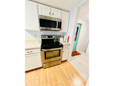 Welcome to this beautifully maintained 2-bedroom, 2-bath home in on Pine Lakes Country Club in Florida - for sale on GolfHomes.com, golf home, golf lot