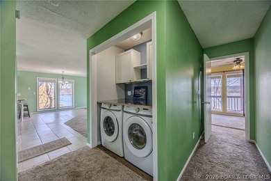 This isn't your typical lake condo-step inside and you'll feel on Lake Valley Country Club in Missouri - for sale on GolfHomes.com, golf home, golf lot