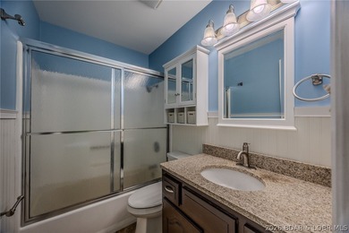 This isn't your typical lake condo-step inside and you'll feel on Lake Valley Country Club in Missouri - for sale on GolfHomes.com, golf home, golf lot