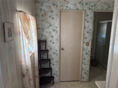 Spacious 2-bedroom, 2-bath home on a large corner lot with over on Zellwood Station Country Club in Florida - for sale on GolfHomes.com, golf home, golf lot