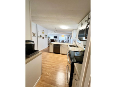 Welcome to this beautifully maintained 2-bedroom, 2-bath home in on Pine Lakes Country Club in Florida - for sale on GolfHomes.com, golf home, golf lot