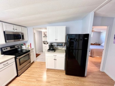 Welcome to this beautifully maintained 2-bedroom, 2-bath home in on Pine Lakes Country Club in Florida - for sale on GolfHomes.com, golf home, golf lot
