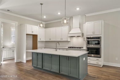 Welcome to your ideal coastal retreat! This beautiful 1.5 story on Crow Creek Golf Club in North Carolina - for sale on GolfHomes.com, golf home, golf lot