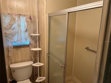 Spacious 2-bedroom, 2-bath home on a large corner lot with over on Zellwood Station Country Club in Florida - for sale on GolfHomes.com, golf home, golf lot