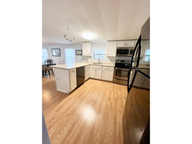 Welcome to this beautifully maintained 2-bedroom, 2-bath home in on Pine Lakes Country Club in Florida - for sale on GolfHomes.com, golf home, golf lot