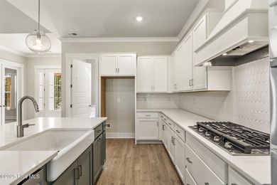 Welcome to your ideal coastal retreat! This beautiful 1.5 story on Crow Creek Golf Club in North Carolina - for sale on GolfHomes.com, golf home, golf lot