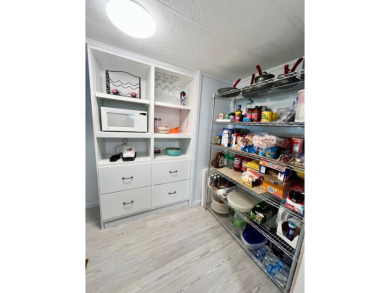 Welcome to this beautifully maintained 2-bedroom, 2-bath home in on Pine Lakes Country Club in Florida - for sale on GolfHomes.com, golf home, golf lot