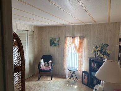 Spacious 2-bedroom, 2-bath home on a large corner lot with over on Zellwood Station Country Club in Florida - for sale on GolfHomes.com, golf home, golf lot