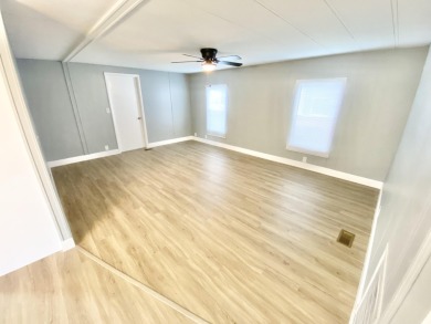 Remodeled Double-Wide manufactured home located in one of the on Barefoot Bay Golf Course in Florida - for sale on GolfHomes.com, golf home, golf lot