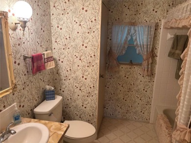 Spacious 2-bedroom, 2-bath home on a large corner lot with over on Zellwood Station Country Club in Florida - for sale on GolfHomes.com, golf home, golf lot