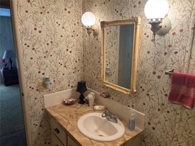 Spacious 2-bedroom, 2-bath home on a large corner lot with over on Zellwood Station Country Club in Florida - for sale on GolfHomes.com, golf home, golf lot
