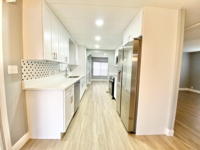 Remodeled Double-Wide manufactured home located in one of the on Barefoot Bay Golf Course in Florida - for sale on GolfHomes.com, golf home, golf lot