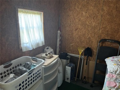 Spacious 2-bedroom, 2-bath home on a large corner lot with over on Zellwood Station Country Club in Florida - for sale on GolfHomes.com, golf home, golf lot