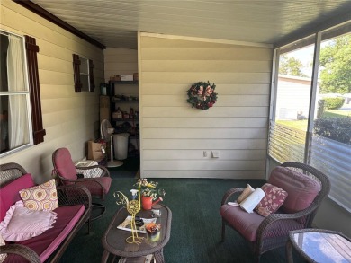 Spacious 2-bedroom, 2-bath home on a large corner lot with over on Zellwood Station Country Club in Florida - for sale on GolfHomes.com, golf home, golf lot