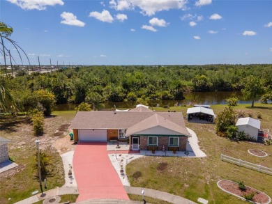 Tucked away on a quaint cul-de-sac, this WATERFRONT POOL HOME in on Duffys Golf Center in Florida - for sale on GolfHomes.com, golf home, golf lot
