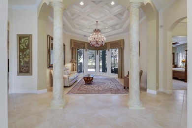 CUSTOM BUILT POOL HOME WITH GOLF & WATER VIEWS in the on The Legacy Golf and Tennis Club in Florida - for sale on GolfHomes.com, golf home, golf lot