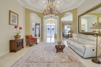 CUSTOM BUILT POOL HOME WITH GOLF & WATER VIEWS in the on The Legacy Golf and Tennis Club in Florida - for sale on GolfHomes.com, golf home, golf lot