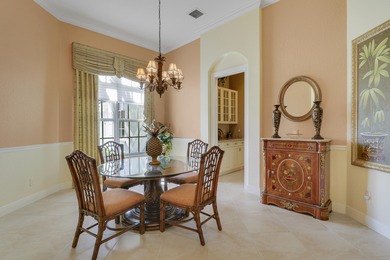 CUSTOM BUILT POOL HOME WITH GOLF & WATER VIEWS in the on The Legacy Golf and Tennis Club in Florida - for sale on GolfHomes.com, golf home, golf lot