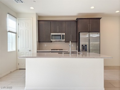 Discover elevated living in this stunning townhome nestled in on Reflection Bay Golf Club in Nevada - for sale on GolfHomes.com, golf home, golf lot