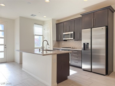 Discover elevated living in this stunning townhome nestled in on Reflection Bay Golf Club in Nevada - for sale on GolfHomes.com, golf home, golf lot