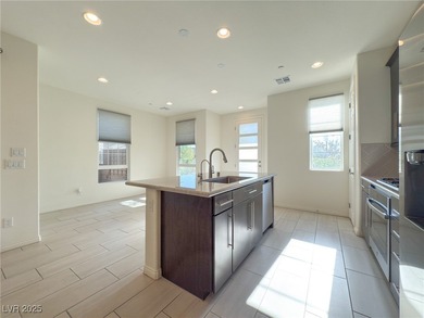 Discover elevated living in this stunning townhome nestled in on Reflection Bay Golf Club in Nevada - for sale on GolfHomes.com, golf home, golf lot