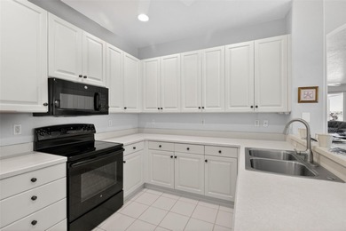 Lovely 2BD/2BA END UNIT villa located in The Links at Pelican on Pelican Pointe Golf and Country Club in Florida - for sale on GolfHomes.com, golf home, golf lot