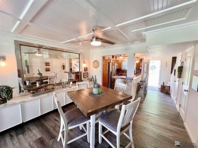 Floor to ceiling windows capture the relaxing golf course views on Yuma Golf and Country Club in Arizona - for sale on GolfHomes.com, golf home, golf lot