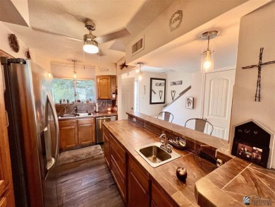 Floor to ceiling windows capture the relaxing golf course views on Yuma Golf and Country Club in Arizona - for sale on GolfHomes.com, golf home, golf lot