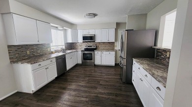 Charming ranch style home situated on the 15th hole of White on White Deer Country Club in Michigan - for sale on GolfHomes.com, golf home, golf lot