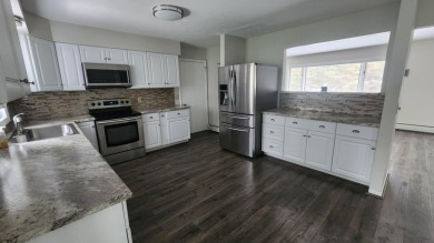 Charming ranch style home situated on the 15th hole of White on White Deer Country Club in Michigan - for sale on GolfHomes.com, golf home, golf lot