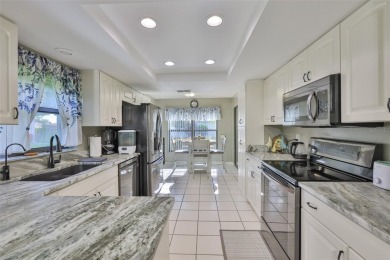 MOVE-IN READY and beautifully updated 2 bedroom, 2 bath expanded on Falcon Watch Golf Club in Florida - for sale on GolfHomes.com, golf home, golf lot