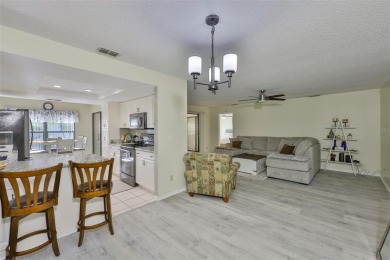 MOVE-IN READY and beautifully updated 2 bedroom, 2 bath expanded on Falcon Watch Golf Club in Florida - for sale on GolfHomes.com, golf home, golf lot