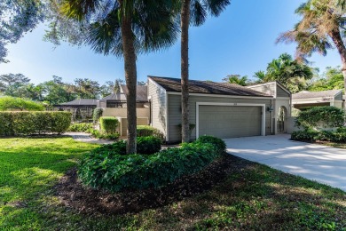 Enjoy serene lake views from this beautiful villa in the on Wyndemere Country Club in Florida - for sale on GolfHomes.com, golf home, golf lot