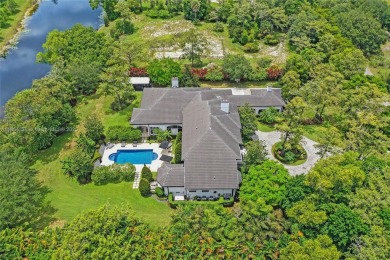 A modern French Chateau in Parkland's most exclusive enclave on Parkland Golf Club in Florida - for sale on GolfHomes.com, golf home, golf lot