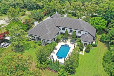 A modern French Chateau in Parkland's most exclusive enclave on Parkland Golf Club in Florida - for sale on GolfHomes.com, golf home, golf lot