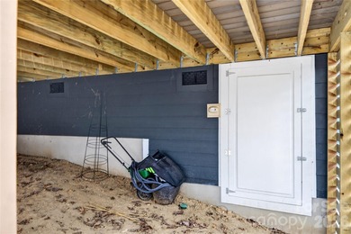 Refined custom construction meets elevated golf-course living in on Club At Irish Creek in North Carolina - for sale on GolfHomes.com, golf home, golf lot
