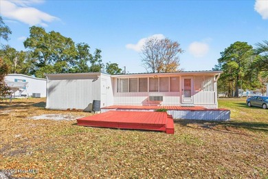 Come home to your beach getaway. This two bedroom, two flex on Oyster Bay Golf Links in North Carolina - for sale on GolfHomes.com, golf home, golf lot